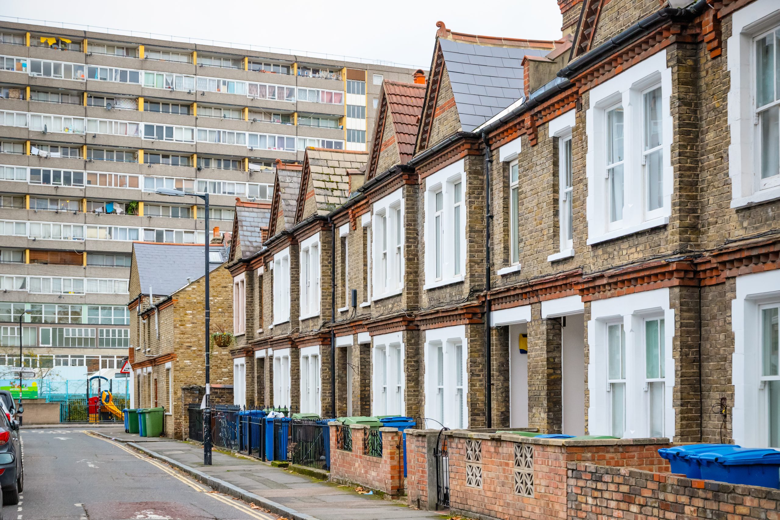 Terraced houses in London with council block in the background
